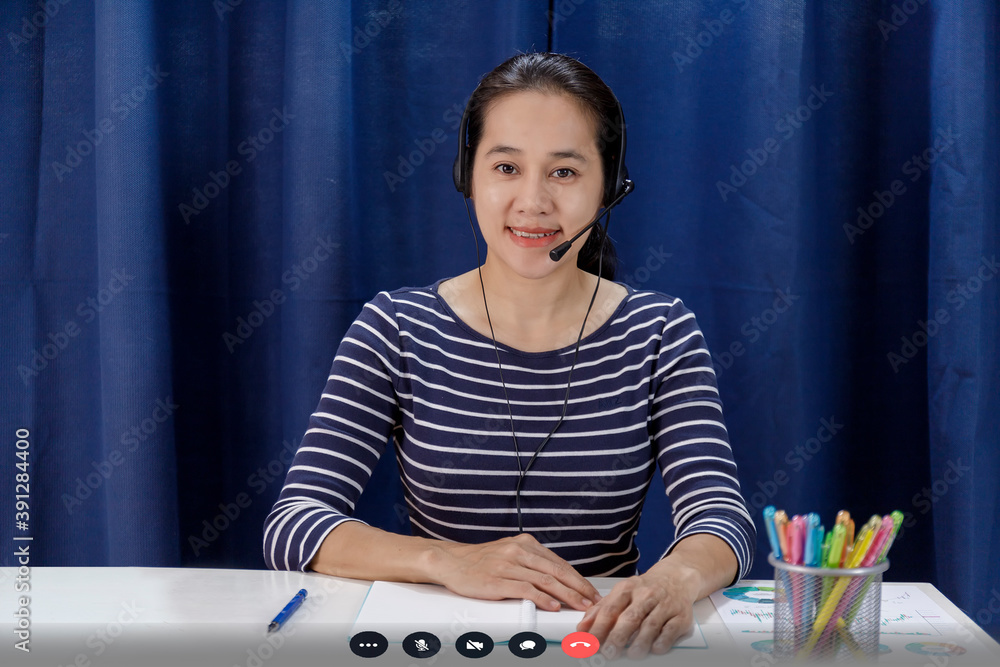 Screen of businesswoman talking with video call, video conference meeting at home. Business people working at home with online video call looking at camera Screen of businesswoman talking with video call, video conference meeting at home. Business people working at home with online video call looking at camera