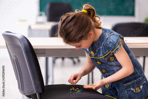Tableau sur toile Secondary school prank with sharp thumbtacks on chair