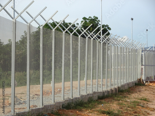 Wall Mural MELAKA, MALAYSIA -JUNE 5, 2020: Anti-climb fencing made from galvanized iron install at the perimeter or property boundary to prevent from the intruder