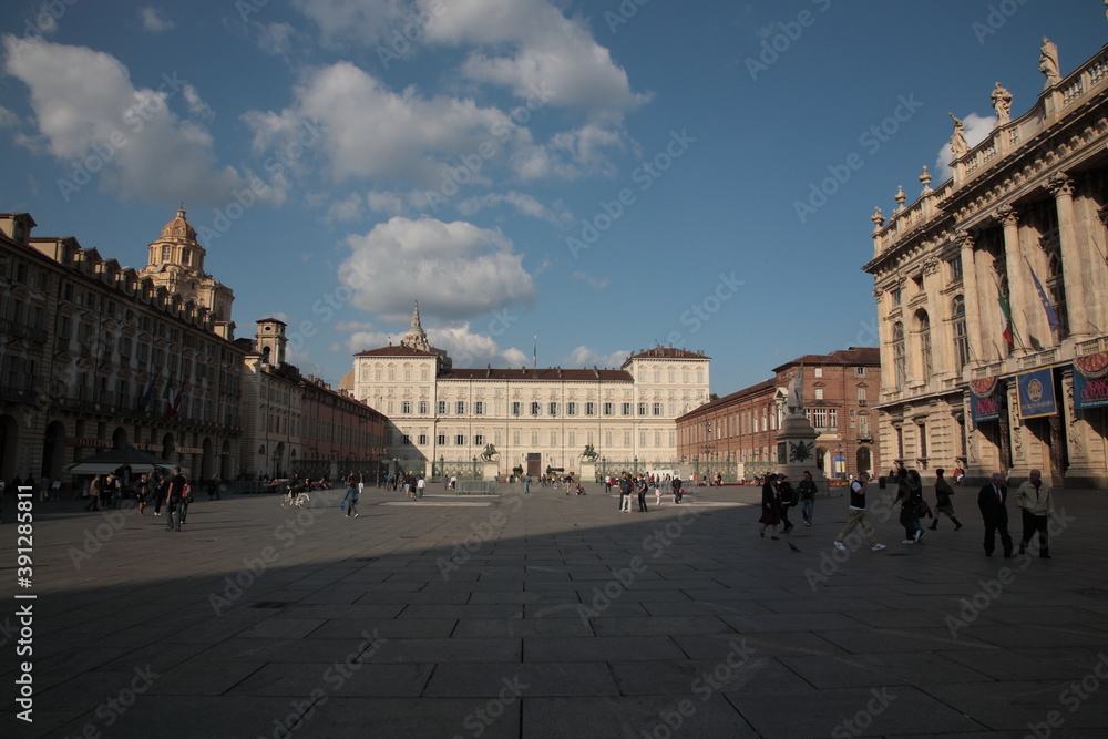 View of city square Piazza Castello and  Royal Palace of Turin under blue sky in Turin, Italy