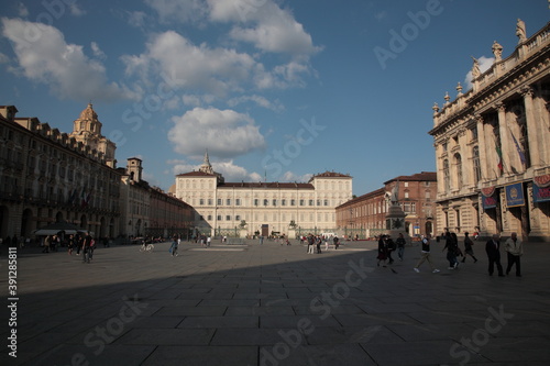 View of city square Piazza Castello and Royal Palace of Turin under blue sky in Turin, Italy