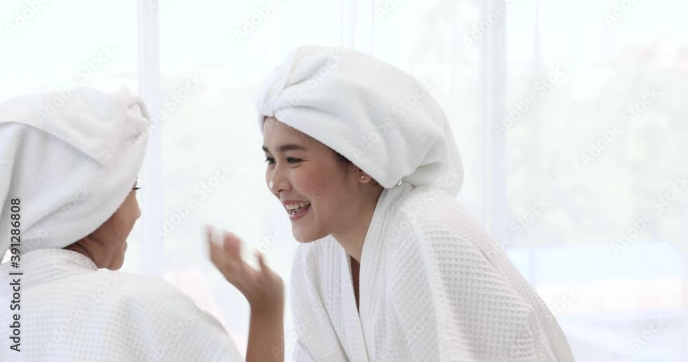 Mother and her kid are applying cream on face of each other, Skincare, Spa. Mother and her kid are applying cream on face of each other, Skincare, Spa.