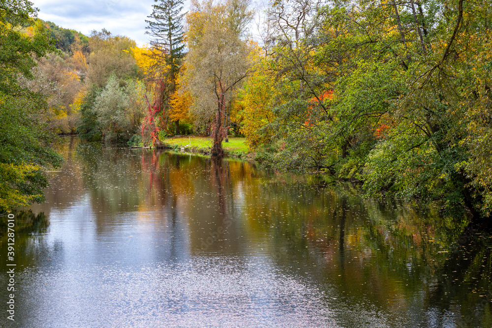 River Glan surrounded with multi colored trees River Glan surrounded with multi colored trees