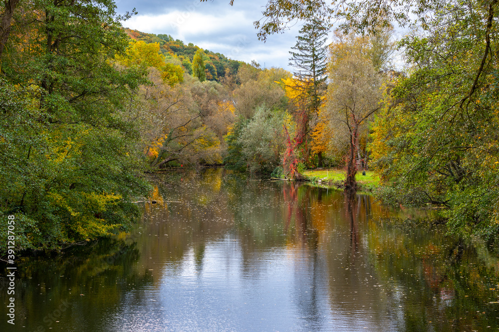 River Glan surrounded with multi colored trees River Glan surrounded with multi colored trees