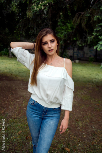 woman portrait outdoor in the green park