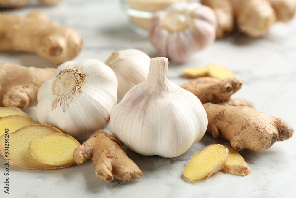 Ginger and fresh garlic on table. Natural cold remedies Ginger and fresh garlic on table. Natural cold remedies