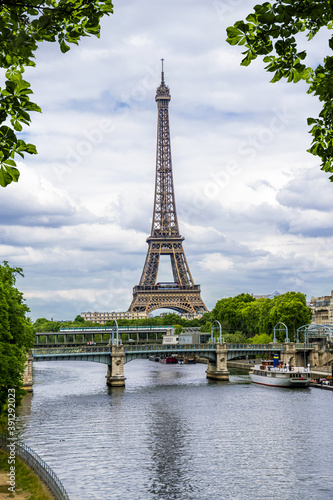 Eiffel tower on the background of the river Seine surrounded by leaves. Paris. France. © Svetlana