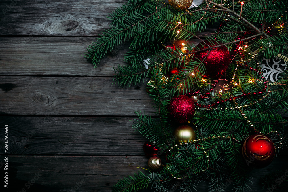New Year and Christmas composition of a live fir tree and toys in red tones. Place for text New Year and Christmas composition of a live fir tree and toys in red tones. Place for text