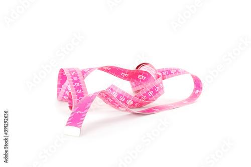 New pink measuring tape isolated on white