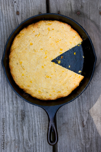 Corn bread with farmers cheese on frying pan