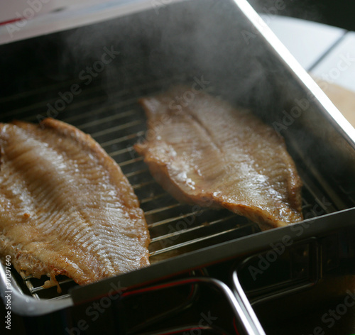 Close up of smoked catfish on grill photo