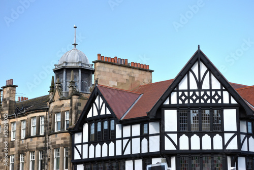 Roof Line of Old Buildings against Blue Sky with Lead Cupola & Timber Frame Details 