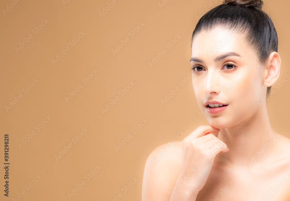 Beauty face of the young beautiful woman skin natural make up. skin color background. close up face beauty portrait Beauty face of the young beautiful woman skin natural make up. skin color background. close up face beauty portrait