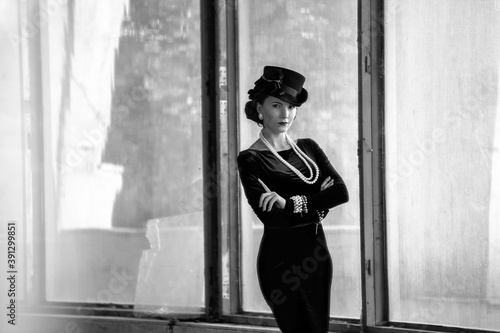 Beautiful woman as Coco Chanel photo