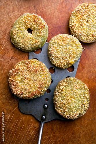 Overhead view of fried green tomatoes and spatula