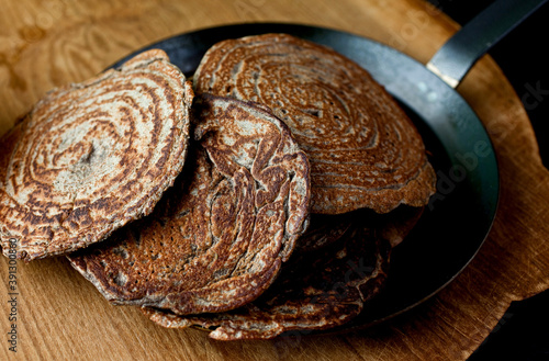 Buckwheat blini on frying pan