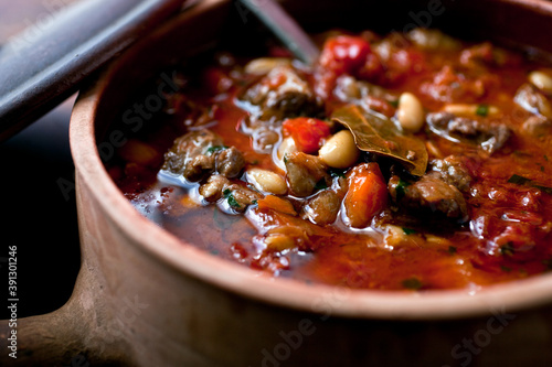Spanish style lamb stew in pot