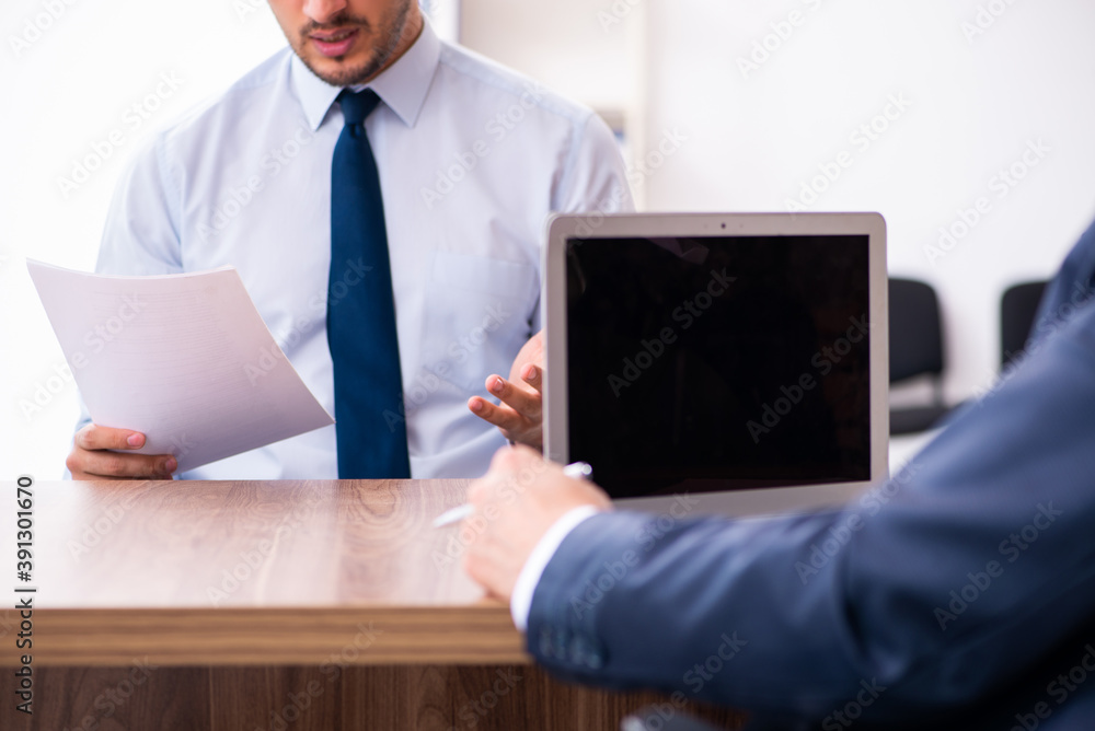 Young male candidate employee meeting with old recruiter Young male candidate employee meeting with old recruiter