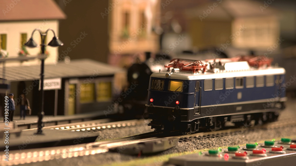 Miniature train carriage on the station. Retro railway model.