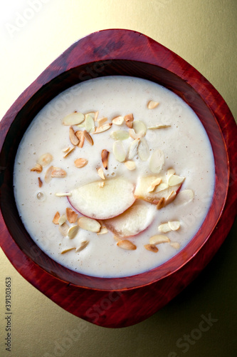 Close up of pudding with almonds and apple slices