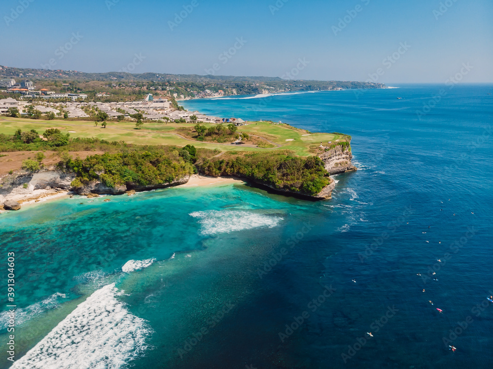 Blue ocean and cliff at background. Aerial view of tropical island with wave