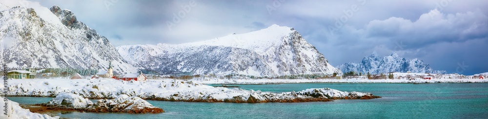 Fabulous snowy winter scene of  Valberg village with snowy  mountain peaks on Lofoten Islands