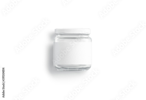 Blank small glass jar with white label mockup lying, isolated