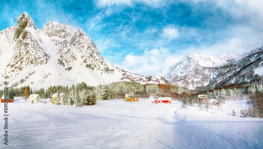 Gorgeous winter scenery with traditional Norwegian wooden houses and pine trees near Valberg village at Lofotens. Gorgeous winter scenery with traditional Norwegian wooden houses and pine trees near Valberg village at Lofotens.