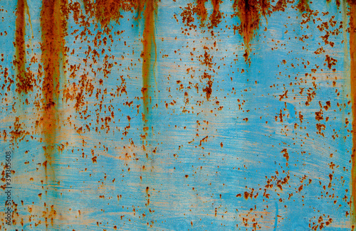 Texture of a rusty metal surface: dark blue, blue, aged cracked paint. Abstract background.