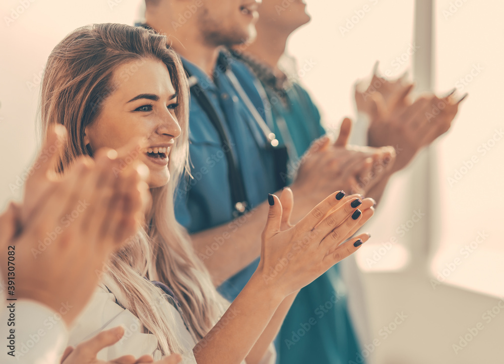 close up. a group of medical colleagues applauding during the workshop close up. a group of medical colleagues applauding during the workshop
