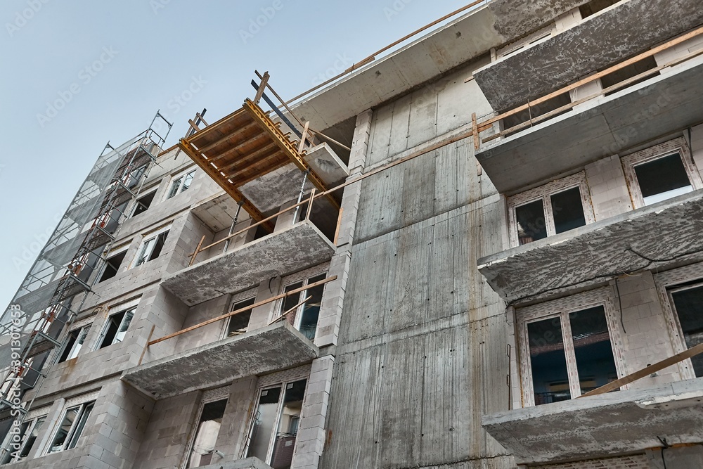 Apartment building block of flats under construction in a city urban area Apartment building block of flats under construction in a city urban area