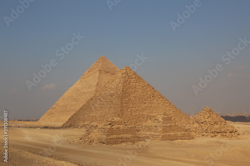 A picture of five of the great historical pyramids of Giza in the light of day  one of the Seven Wonders of the World  Giza - Egypt