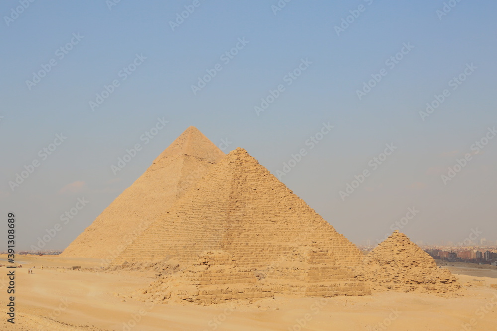 A picture of five of the great historical pyramids of Giza in the light of day, one of the Seven Wonders of the World, Giza - Egypt A picture of five of the great historical pyramids of Giza in the light of day, one of the Seven Wonders of the World, Giza - Egypt