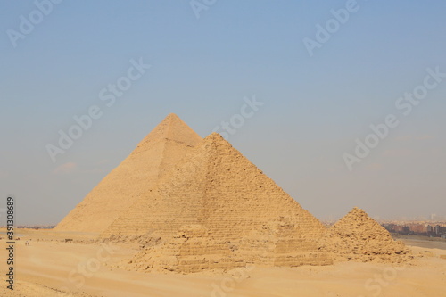 A picture of five of the great historical pyramids of Giza in the light of day  one of the Seven Wonders of the World  Giza - Egypt