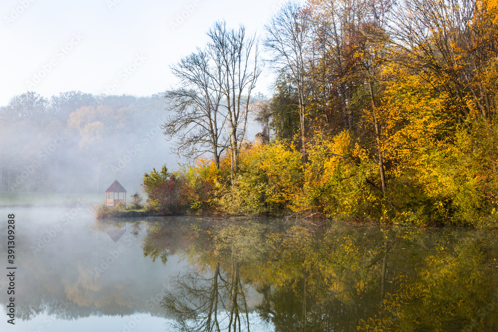 Beautiful landscape with lake and forest. Amazing nature wallpaper. Autumn trees in foggy morning. Romantic place. Beautiful landscape with lake and forest. Amazing nature wallpaper. Autumn trees in foggy morning. Romantic place.