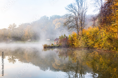 Wallpaper Mural Beautiful landscape with lake and forest. Amazing nature wallpaper. Autumn trees in foggy morning. Romantic place.  Torontodigital.ca