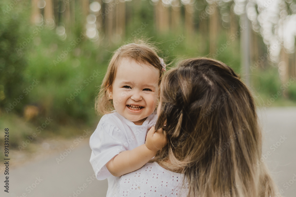 mother and little daughter together have fun playing and hugging, the concept of happy motherhood and childhood, love for the child mother and little daughter together have fun playing and hugging, the concept of happy motherhood and childhood, love for the child