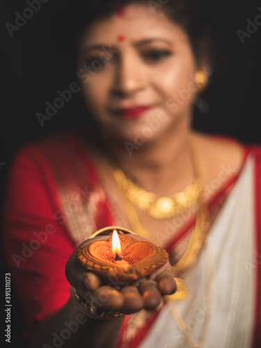 A Woman wearing red and white saree stock image. photo