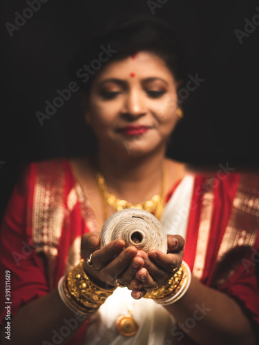 A Woman wearing red and white saree stock image. photo