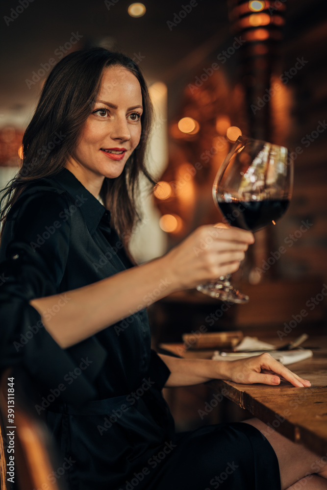 lady in the bar toasting