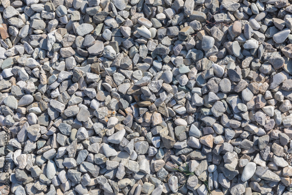 The texture of fine gravel scattered on the ground The texture of fine gravel scattered on the ground