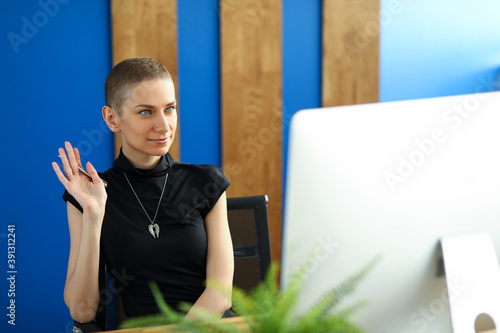 Girl welcomes online via video conferencing