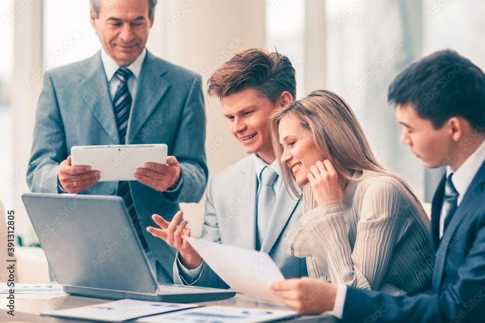 successful business team discussing a plan of the company in the office successful business team discussing a plan of the company in the office