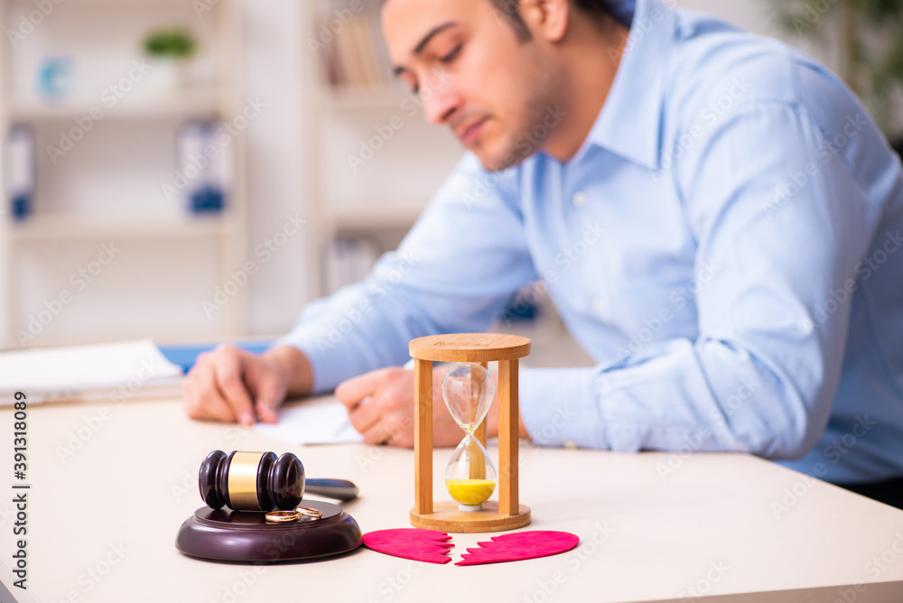Young man in courthouse in divorcing concept Young man in courthouse in divorcing concept