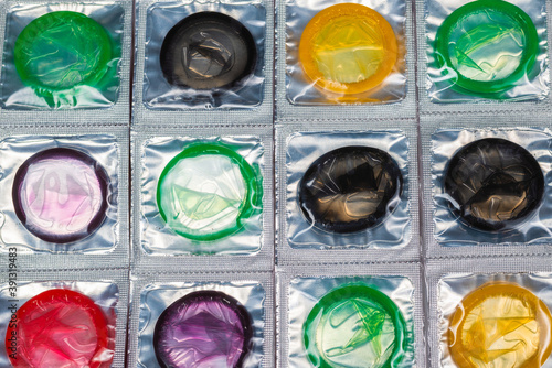 Colorful condoms backgrouaids, care, colorful, condom, condoms, contraception, contraceptive, disease, erection, group, health, healthy, latex, love, many, multicolored, preservative, prevention, pnd.