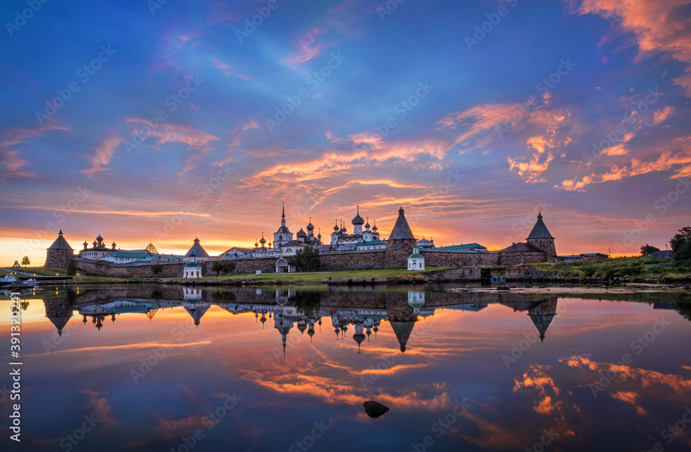 Solovetsky Monastery with a mirror image in the water of the Bay of Prosperity