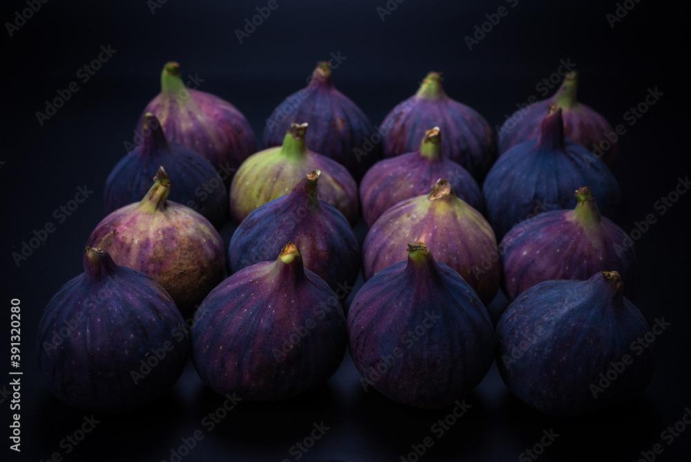 Tasty figs on a black background. Top view. Tasty figs on a black background. Top view.