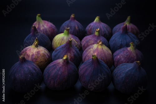 Tasty figs on a black background. Top view. © Nikolay