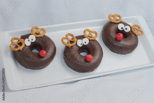 ISOLATED CHOCOLATE FROSTED REINDEER DONUTS