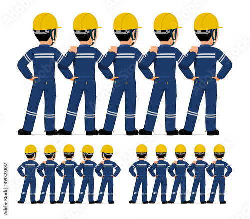 Five industrial workers standing together on white background